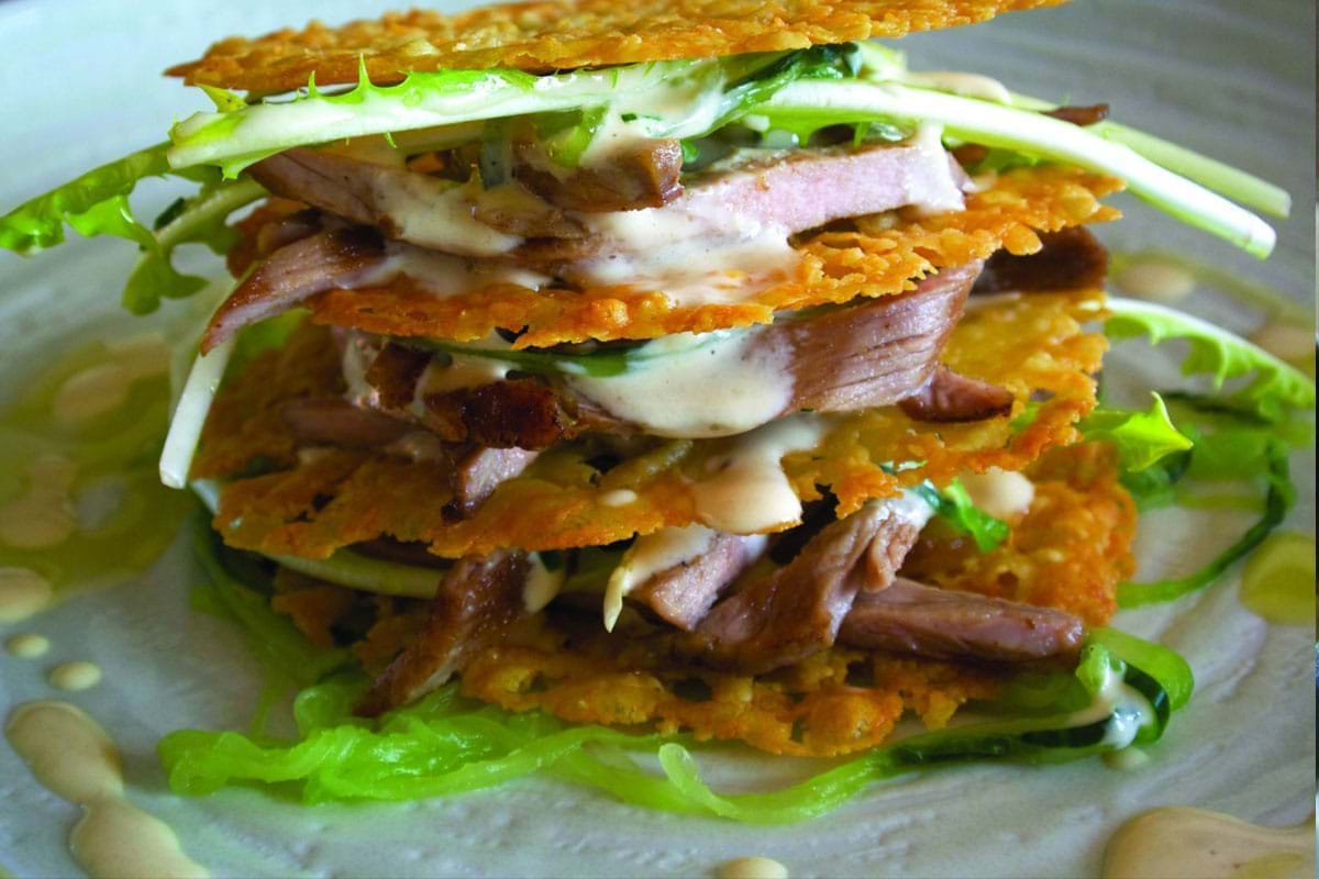 Colliers Cheese Collier’s Cheddar Tuiles with Grilled Pork Tenderloin, Salted cucumber and Garlic Dressing